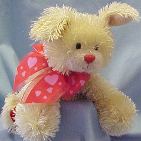 Gund Valentines Plush Tootsie the Shaggy Dog Gund Valentines Plush Tootsie the Shaggy Dog
- Material is super silky soft shaggy which reminds me of the old fashioned flapper girl dresses from the 1920's. Back paws have red velvety heart shape pads. There is a sheer and satiny red bow with pink hearts all over it tied around the neck.
- safe for all ages