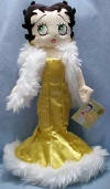 Christmas Betty Boop Plush Doll - Betty is wearing a golden silky dress w faux fur trim, faux fur stole, and golden earrings.  She is dressed to the 9.  15 inches high