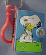 Snoopy Notebook Key Chain 2 1/4 inches high 1 3/4 inches wide 1/2 inch deep