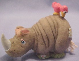 Precious Moments Saminal Rhinoceros - the rhino's puzzle piece reads: "Home of the Rhino. Be sure to find all his friends!" 1 1/2 inches high by 2 inches wide by 1 inch deep