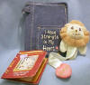 Precious Moments Daniel's Lion with New Testament - Blue Jean book cover holds New Testament Psalms. Cover measures:  5" x 3.5" x .75"  Bible measures:  4.5" x 2.75" x .5"  Bookmark measures:  7.5" L Lion bookmark can be stored in outside pocket of Blue Jean book cover.  Tag is shaped like a Bible and reads:  All God's Creatures  I Have Strength in My Heart  Inside tag reads Daniel 6:21:23  and also: Daniel was thrown into my lion's den when he refused to pray to the king of Babylon.  Because of his unending loyalty and faith.  God preserved him and we became friends.