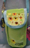 Disney's Lizzie McGuire Cell Phone or Glasses Case - (safe for ages over 3)  Materials are velvety and silky BRIGHT colors.  The handle could be clipped onto a belt or backpack.  The strap is 9" long, the clip is 1.25".  Cell Phone Case is 3 inches wide by 6 inches high by 1 1/2 inches thick