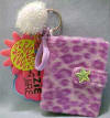 Disney's Lizzie McGuire Photo Album Key Ring - (safe for ages over 3)  This is a key ring clip on with a glittery pom pom and a picture of Lizzie with the words Seriously Cool!  Inside the album is space for 8 pictures 2 1/2" x 1 3/4"  The Album is 3 1/2 inches high by 2 1/2 inches wide by 3/4 inches thick