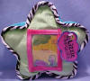 The pillow is 9 inches wide by 6 1/2 inches high by 1/2 inch thick