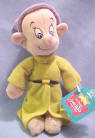 Disney's Seven Dwarf Dopey - Tag Reads: "The youngest Dwarf, Dopey is sweet, innocent and kind.  Always tripping over his sleeves and trailing behind the others, Dopey communicates with sign language, ear wiggling and cheerful nods." 7 1/2 inches