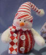 Candy Cane Snowman with Red Scarf Christmas Ornament. It has a gift card which as To and From. The card also reads Gentle as snowflakes, Holiday Memories, drift into the heart and lead us home. 5 inches high