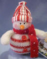 Candy Cane Snowman with polka dotted scarf Christmas Ornament. It has a gift card which as To and From. The card also reads Gentle as snowflakes, Holiday Memories, drift into the heart and lead us home. 5 inches high