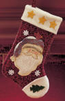 Gund Country Kringles Large Christmas Stocking. The stocking is a variegated maroon color flannel like material with a hanger on top to match.  It has a beautiful glittery Santa  on the front along with glittery snowflakes, stars, bird and Christmas tree.  The inside of the stocking is completely lined with cotton. This is a quality Christmas stocking which could be a keepsake for many years to come. 8 1/2 inches high 