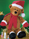 Gund Santa Raisin Teddy Bear Purse This ADORABLE raisin brown Teddy Bear purse is wearing a red Santa hat, red gloves and scarf.  The purse opening is velcro and is on the back of the Teddy Bear. 13 1/2 inches high