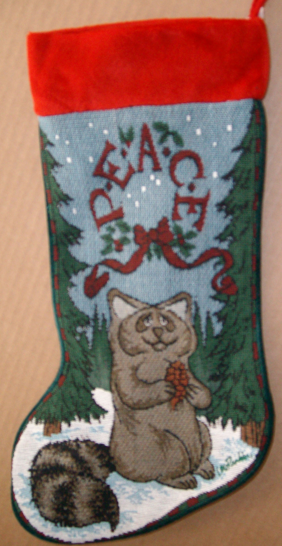 Click here to go to our selection of Collectible Lou Rankin Christmas Raccoon Stockings