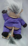 Back view of 1 Dozen InFamous Meanies Donkeyng (Don King) - (Infamous Series 1) Poem on tag: the promoter is brash, with his smile, his cash and his flash. More than anything else, he's promoted himself. But that "suit" can't quite cover his @#!