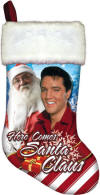 Elvis Presley "Here Comes Santa Claus" Christmas Stocking  - This stocking is amazingly beautiful.&nbsp; The top of the stocking is white faux fur.&nbsp; The bottom of the stocking is a very soft brushed material.&nbsp; It has a picture of Elvis with a big smile dressed in red with packages.&nbsp; Santa is standing next to Elvis.&nbsp; The imprint reads: "Here Comes Santa Claus".&nbsp; The inside of the stocking is a silky material.&nbsp; There is a red velvety hanger attached at the top to use to hang the stocking by the chimney with care!&nbsp; The stocking should hold lots of small goodies or several big ones.&nbsp; The Stocking is approximately 15"&nbsp; tall with a 10" wide toe.