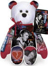 Elvis 'Heartbreak Hotel' Teddy Bear - (this is the 14th bear in the series) The Elvis Heartbreak Hotel Bear has colorful images of Elvis singing 'Heartbreak Hotel' along with other images depicting 'Heartbreak Hotel' Both the front and the back of the bear are GREATLY detailed! The Bear wears a tag with information about the 'Heartbreak Hotel' single release: "Elvis' first recording session with RCA is held two days after his twenty-first birthday. "Heartbreak Hotel" is among the songs laid to tape. On January 27, 1956, the single "Heartbreak Hotel" is released. This becomes Elvis' first # 1 hit on the Billboard pop charts, where it remains for eight weeks. It also hits #1 on the country chart and #5 on the R&B chart. The song becomes Elvis' first single to sell over 1 million copies and earns him his first gold record." 9 inches high