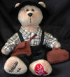 Classic Collecticritter I Love Lucy  Episode 64 "The Camping Trip" Teddy Bear - This brand new adorable bear is recreated after one of the episode that first aired on June 8, 1953. Anxious to join Ricky on a camping trip, in order to have more shared interests, Lucy dresses up to prove she is just as outdoorsy as her husband! One foot has Episode #64 embroidered and the other has the classic Red "I Love Lucy" logo. Limited to only 1,500 numbered pieces, this bear is a must have for any collector.  Individually numbered.   11 inches