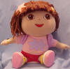 Dora the Explorer Plush Doll with Backpack - &nbsp;Her backpack can be removed with a snip of a few threads.  Her clothes are not removable.  Pink shirt reads Friends in both English and Spanish  11 inches