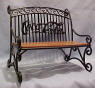 Coca Cola Wrought Iron Bench - dated 1999 on the bottom of the bench 8 inches long 5 3/4 inches deep 7 1/2 inches high