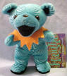 Liquid Blues' Grateful Dead Bean Bear Haight - quantity produced 67,584 Retired 10/5/00 Born Born 3/3/68 at Haight Street Tour Memory: I was at Shoreline when I came upon a little girl all alone and in tears. I stopped and asked where her parents were and she said "lost." She stopped crying and told me where she had seen her parents last. After a short search, we were lucky enough to find her parents. They were so grateful that they took all of us to their house after the show and cooked a feast for all. Another tragedy narrowly averted! 7 1/2 inches tall