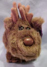 Puffkins Bean Bag Plush Gus the Moose - DOB 1/10/97 (dark purple tag) Gus is the biggest moose around, he eats and eats, not gaining a pound. Gus loves to play hide-n-seek, he's so good you might not find him for a week. (1 of the Original 13 Puffkins and has been retired) 5 1/2 inches
