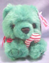 Puffkins Bean Bag Plush Jingles the Green Christmas Bear - DOB 12/15/97  Jingles is a green bear with a treat just for you.  He'll share his candy cane and his Christmas gifts too.  There's nothing quite as nice as a hug from Jingles. On Christmas morning, his hug will give you tingles.  (Limited Edition Christmas 1998) 5 inches