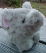 Puffkins Bean Bag Plush Elly the Elephant - DOB 1/19/97  (light purple tag)  Elly loves the zoo a ton, every time she goes she has so much fun.  All the different animals are so kind, a new friend is something she can always find.  (introduced the Fall of 1997 and has been retired) 5 inches high