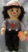 Ethnic Raggedy Andy Rag Doll - Andy is dressed in navy trousers with navy and white checkered shirt and red tie.  He has a navy and white sailor cap on his head. safe for ages over 3