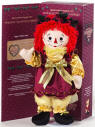 2003 Holiday Tradition Series Raggedy Ann Sugar Plum Fairy - From the Raggedy Ann and Andy Holiday Tradition Series. Sugar Plum Raggedy Ann. Raggedy Ann wears a gold satin blouse and pantaloons with gold bows on the sleeves and ruffled borders. She also wears a gold trimmed maroon satin dress with embroidered leaves and berries. She has satin and felt holly leaves and berries in her hair, and gold bows and tassels on her shoes. This collectible doll has button eyes and embroidered facial features, and is being presented in a Limited Edition of only 5,000 pieces. Packed in a festive holiday window box with Certificate of Authenticity. Designed by Janie Jones.  She is 18 inches high.