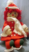 2000 Christmas Raggedy Ann Skater - Velour Christmas green pantaloons, Red and Green ice skates, An EXTREMELY soft red double breasted coat trimmed in white, A matching hat and A very soft white scarf 16 inches