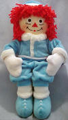 2001 Winter Raggedy Andy Plush Rag Doll - This Winter 2001 Raggedy Andy doll celebrates the winter for 2001.  He has an embroidered face with black button eyes.  (safe for ages over 3) 17 inches