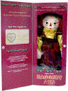 2003 Holiday Tradition Series Raggedy Ann Sugar Plum Fairy - From the Raggedy Ann and Andy Holiday Tradition Series. Sugar Plum Raggedy Ann. Raggedy Ann wears a gold satin blouse and pantaloons with gold bows on the sleeves and ruffled borders. She also wears a gold trimmed maroon satin dress with embroidered leaves and berries. She has satin and felt holly leaves and berries in her hair, and gold bows and tassels on her shoes. This collectible doll has button eyes and embroidered facial features, and is being presented in a Limited Edition of only 5,000 pieces. Packed in a festive holiday window box with Certificate of Authenticity. Designed by Janie Jones.  She is 18 inches high.