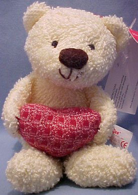 Click here to go to our selection of Russ Berrie Valentine's Day Heart Warmers Plush Puppies Elephants and Bears holding red hearts