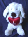Russ Berrie Plush Luv Pup with Red Heart I Love You is written on the front of the satiny red heart  7 1/2 inches