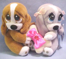 We have many Sad Sam & Honey Basset Hounds available in Birthstone Months.  The adorable Basset Hounds hold a dog bone between them with a ribbon and birthstone on the bone.