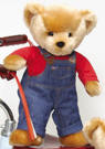 Blue Jean Teddy - Blue Jean Teddy is SOFT plush and very cuddly. He is wearing a red shirt and "denim" Bib Overalls, which are not removable. Safe for ages 18 months +