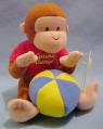 Curious George Wiggler with Blue and Yellow Beach Ball - pull on the ball and watch Curious George Wiggle and Jiggle back to it. 6 inches