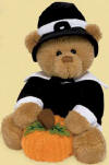 Gund Blake Pilgrim Teddy Bear with Pumpkin  Blake is wearing a black Pilgrim's coat with white collar and cuffs.  On his head is a black hat with white band and black buckle. Blake is holding a pumpkin between his paws. safe for all ages 6 1/2 inches