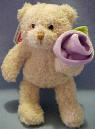 Gund Teddy Bear with Lilac Rose. The Teddy Bear is made from a ultra soft plush material. The rose is velvety soft. 5 1/2 inches  