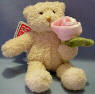 Gund Teddy Bear with Pink Rose The Teddy Bear is made from a ultra soft plush material. The rose is velvety soft. 5 1/2 inches 