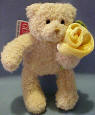 Gund Teddy Bear with Yellow Rose.  The Teddy Bear is made from a ultra soft plush material. The rose is velvety soft. 5 1/2 inches  