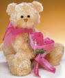 Gund Teddy Bear with Rose Flower Bouquet  The Teddy Bear is made from a ultra soft plush material. The flowers are velvety soft and arranged with netting and matching bow.  11 inches