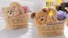 Gund Set of Baskets Teddy Bear & Puppy Dog in Baskets with Flowers the side of the bear basket reads I LOVE YOU MOM and the side of the puppy basket reads SOMEONE SPECIAL  5 inches wide 2 1/2 inches deep 2 1/2 inch handle each basket 3 inch bear and a 3 inch pup