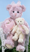 Gund Love Mom purple Teddy Bear with cream baby bear.  In one arm Mom bear carries her baby and in the other she carries a pink heart pillow with I LOVE YOU MOM embroidered on the front. Teddy Bear is super silky soft.  safe for children.  Mom is 16 inches high and baby is 8 inches high