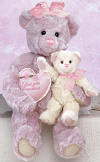 Gund Love Grandma purple Teddy Bear with cream baby bear.  In one arm Grandma bear carries her baby and in the other she carries a pink heart pillow with I LOVE YOU Grandma embroidered on the front. Teddy Bear is super silky soft.  safe for children.  Grandma is 16 inches high and baby is 8 inches high