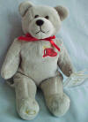 Front View of The God Bless Our Firefighters Teddy Bear Bible Verse inside the tag "When thou passest through the waters, I will be with thee; and through the rivers, they shall not overflow thee; when thou walkest through the fire, thou shalt not be burned; neither shall the flame kindle upon thee." Isaiah 43:2 Bear is 9 inches high