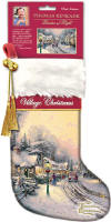 Thomas Kinkade 'Village Christmas' Limited Edition Christmas Stocking - The top of the stocking is white faux fur, then a red velvety stripe with the name of the stocking embroidered in white, and the rest is a SOFT brushed material. There is gold trim embroidered between the colors and textures. The Kinkade logo is embroidered with shiny gold threads onto the toe of the stocking. There is a red velvety hanger attached at the top to use to hang the stocking by the chimney with care! There is a gold tassel with a jingle bell attached to it. 15 inches