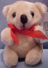 Jointed Plush Mini Teddy Bear with Red Ribbon - eyes are glass like. arms, legs and head are jointed  3 inches