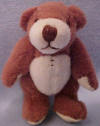 Russ Berrie's World's Tiniest Teddy Bear Brown with Cream paw pads  2 3/4 inches and poseable