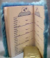 the interior of the address book has Cookie monster peeking over the top of the pages.