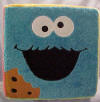 Gund Sesame Street Plush Block with Cookie Monster, Oscar the Grouch, Elmo, Zoe, Grover and Big Bird on each of the sides - each face is on a side of the block.    11 1/2 inch cube