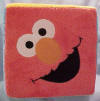 Gund Sesame Street Plush Block with Cookie Monster, Oscar the Grouch, Elmo, Zoe, Grover and Big Bird on each of the sides - each face is on a side of the block.    11 1/2 inch cube
