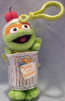 Gund Sesame Street Plush Oscar the Grouch in Trash Can Clip On - Oscar has an apple on his head.  The front of his garbage can reads:  "Slimey is a bookworm!" 5 1/2 inches